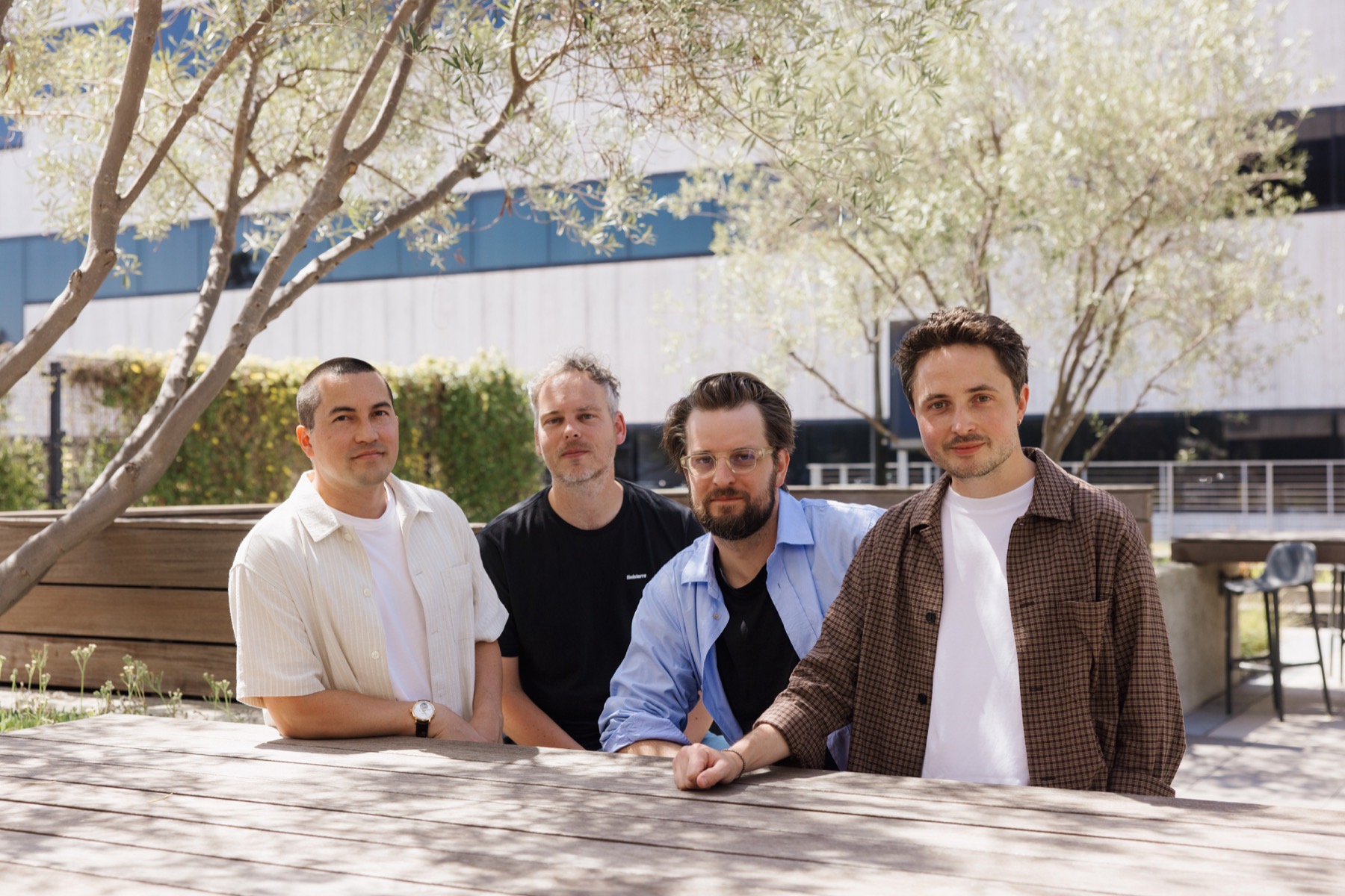The Superlogical founding team seated together outdoors